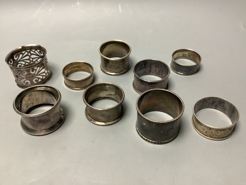 Small silver including nine napkin rings, hip flask cup, miniature tea set, dish etc.